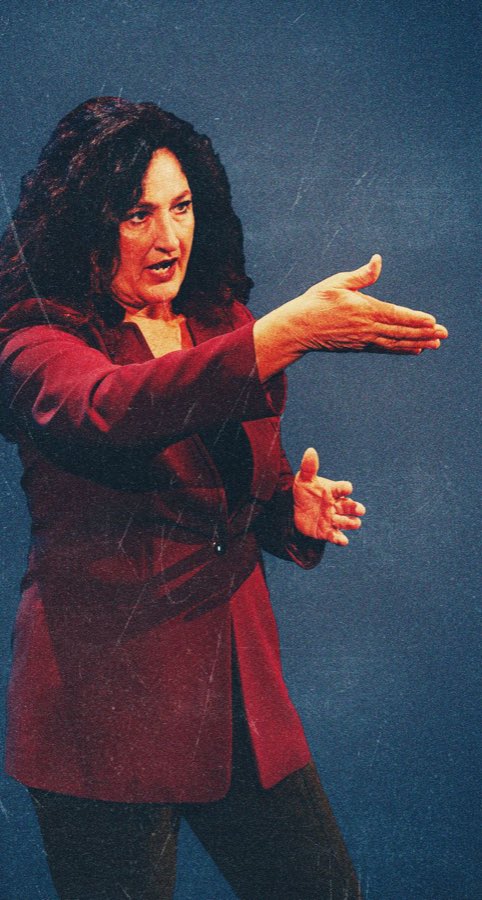 Kathryn Kellner mid-gesture, full-body portrait